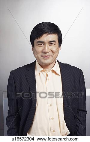 Picture - Portrait of a businessman smiling. Fotosearch