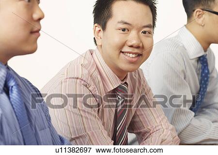 Portrait of a businessman smiling View Large Photo Image Stock Photo - Portrait of a businessman smiling. Fotosearch