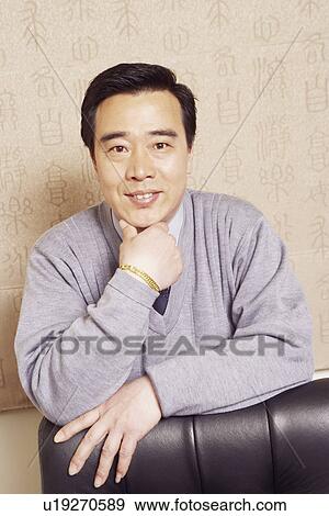Stock Photo - Portrait of a businessman smiling. Fotosearch