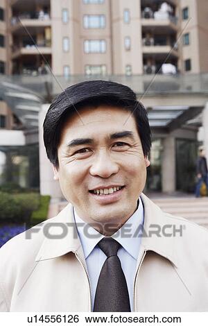 Stock Photograph - Portrait of a mature man smiling. Fotosearch