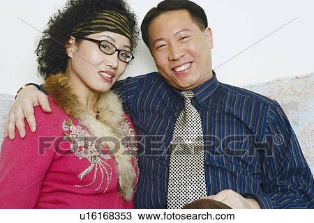 Stock Image - Portrait of a mature man with a mature woman smiling. Fotosearch