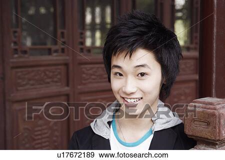 Portrait of a teenage boy smiling View Large Photo Image Stock Photo - Portrait of a teenage boy smiling. Fotosearch