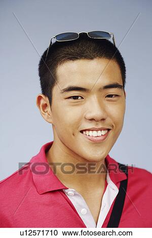 Stock Image - Portrait of a young man smiling. Fotosearch