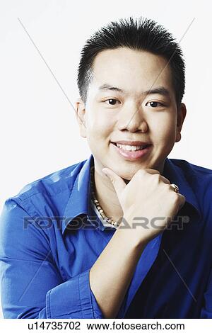Portrait of a young man smiling View Large Photo Image Stock Image - Portrait of a young man smiling. Fotosearch