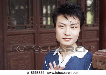 Stock Image - Portrait of a young man smiling. Fotosearch