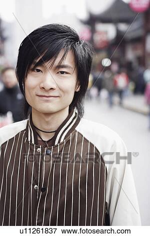Portrait of a young man smiling View Large Photo Image Stock Photo - Portrait of a young man smiling. Fotosearch