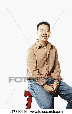 Stock Photograph - Portrait of a young man smiling. Fotosearch