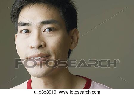 Stock Photo - Portrait of a mid adult man smiling. Fotosearch