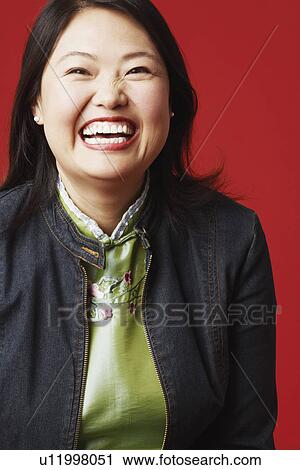 Stock Image - Portrait of a mid adult woman smiling. Fotosearch