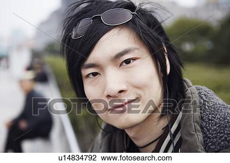 Stock Image - Portrait of a young man smiling. Fotosearch