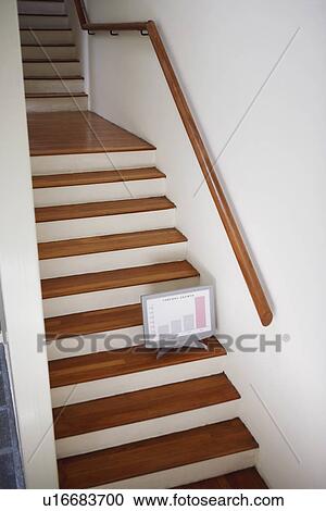 Stock Image - High angle view of a model of computer monitor on a staircase. Fotosearch