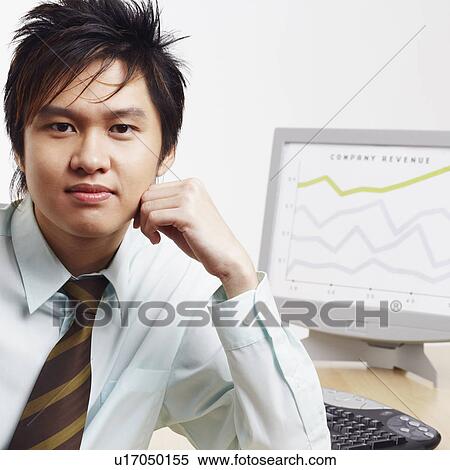Portrait of a businessman with a progress report in the background View Large Photo Image Stock Photography - Portrait of a businessman with a progress report in the background. Fotosearch