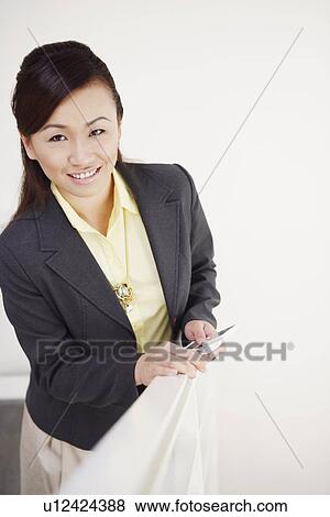 Stock Photo - Portrait of a young woman smiling. Fotosearch