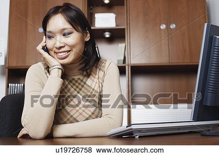 Close-up of a businesswoman using a mobile phone View Large Photo Image Stock Photo - Close-up of a businesswoman using a mobile phone. Fotosearch
