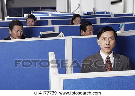 Stock Photo - People working in an office. Fotosearch