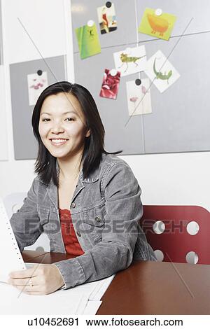 Stock Image - Portrait of a businesswoman smiling. Fotosearch