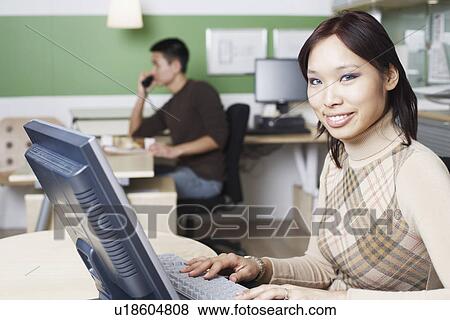 Portrait of a businesswoman using a computer View Large Photo Image Stock Photo - Portrait of a businesswoman using a computer. Fotosearch