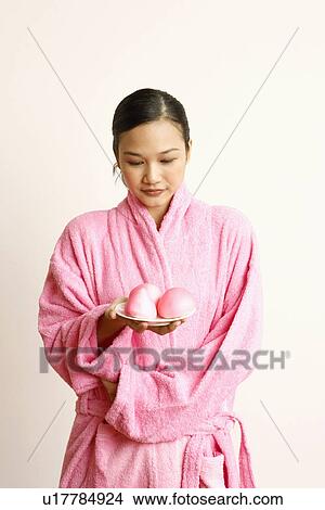 Young woman holding soap in a plate View Large Photo Image Picture - Young woman holding soap in a plate. Fotosearch