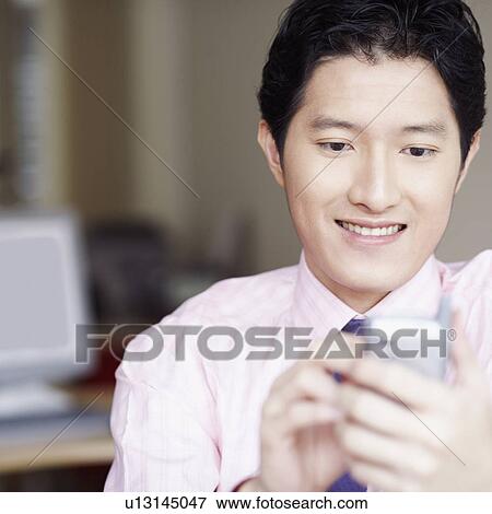 Close-up of a businessman operating a personal data assistant with a digitized pen View Large Photo Image Stock Photo - Close-up of a businessman operating a personal data assistant with a digitized pen. Fotosearch