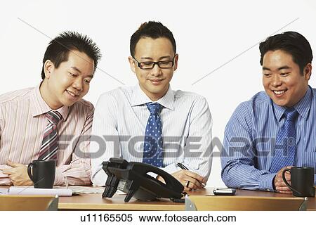 Close-up of three businessmen smiling View Large Photo Image Stock Photography - Close-up of three businessmen smiling. Fotosearch