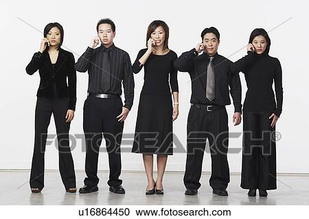 Portrait of three businesswomen and two businessmen using mobile phones View Large Photo Image Stock Image - Portrait of three businesswomen and two businessmen using mobile phones. Fotosearch