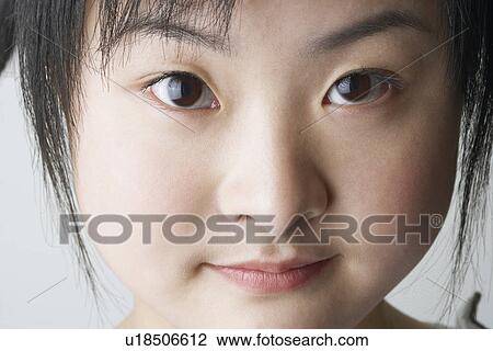 Stock Image - Close-up of a young woman's face. Fotosearch