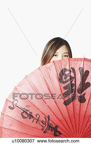 Portrait of a mid adult woman holding a parasol View Large Photo Image Stock Photo - Portrait of a mid adult woman holding a parasol. Fotosearch