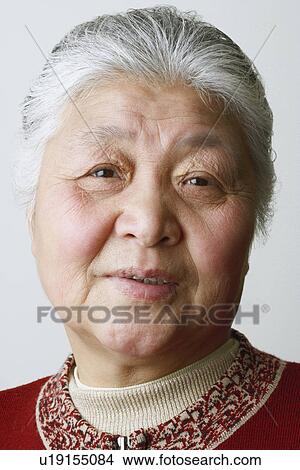 Portrait of a senior woman smiling View Large Photo Image Picture - Portrait of a senior woman smiling. Fotosearch