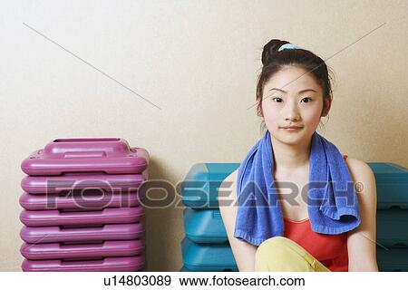 Portrait of a teenage girl sitting in front of stack of aerobic steps View Large Photo Image Stock Photo - Portrait of a teenage girl sitting in front of stack of aerobic steps. Fotosearch