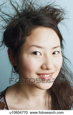 Stock Image - Portrait of a teenage girl smiling. Fotosearch