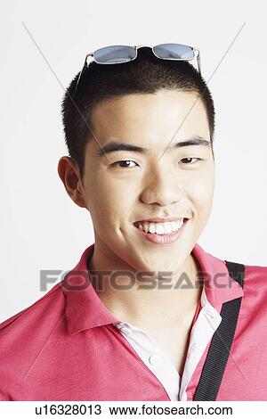 Stock Image - Portrait of a young man smiling. Fotosearch