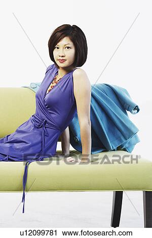 Portrait of a young woman grinning View Large Photo Image Stock Image - Portrait of a young woman grinning. Fotosearch