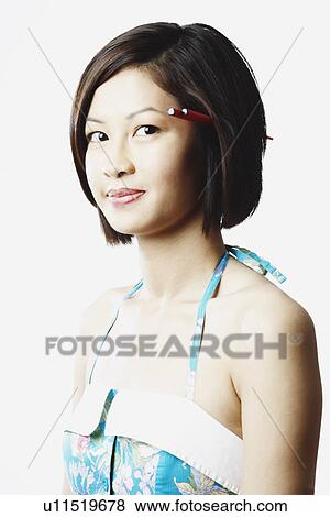 Stock Photo - Portrait of a young woman grinning. Fotosearch