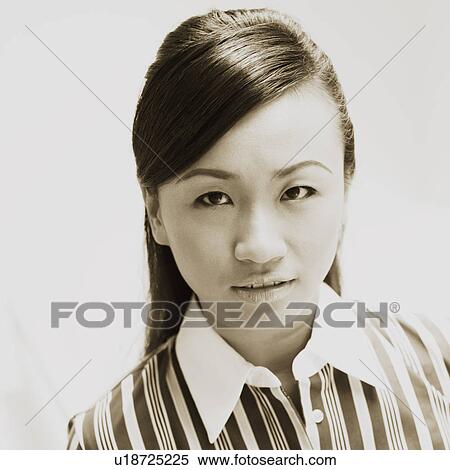 Stock Photography - Portrait of a young woman smiling. Fotosearch