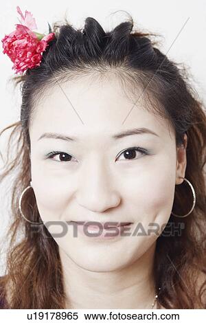 Stock Photography - Portrait of a young woman smiling. Fotosearch
