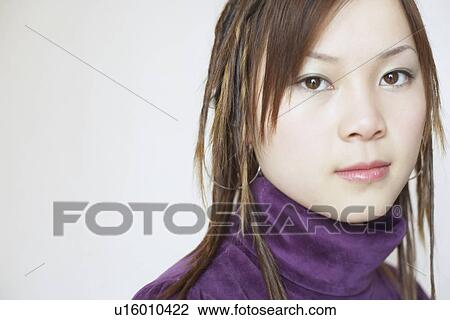 Stock Image - Portrait of a young woman. Fotosearch