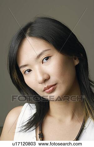 Portrait of a young woman thinking View Large Photo Image Stock Image - Portrait of a young woman thinking. Fotosearch