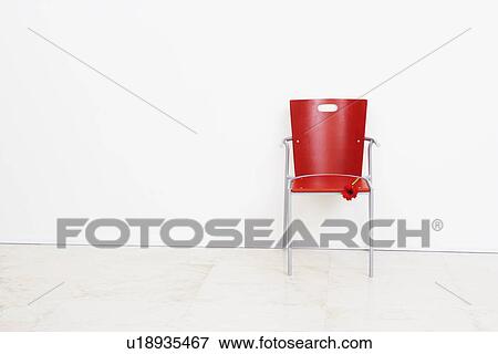 Stock Photo - Flower on an office chair . Fotosearch