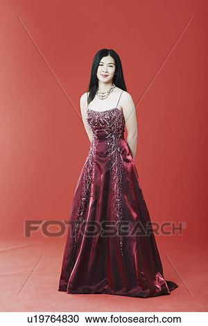 Stock Image - Portrait of a young woman smiling. Fotosearch