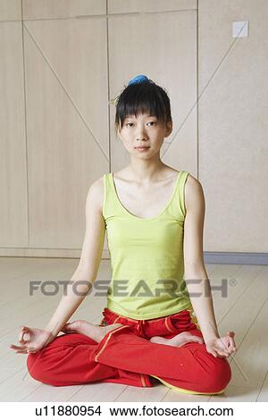 Portrait of a young woman meditating View Large Photo Image Picture - Portrait of a young woman meditating. Fotosearch
