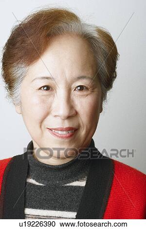 Stock Image - Close-up of a mature woman smiling. Fotosearch