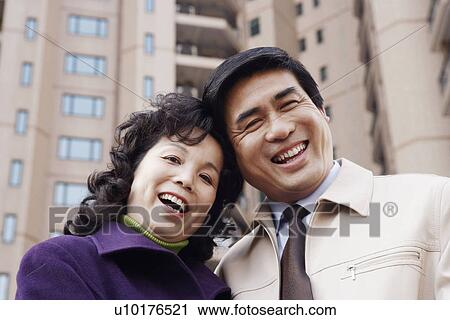 Portrait of a mature couple smiling View Large Photo Image Stock Image - Portrait of a mature couple smiling. Fotosearch