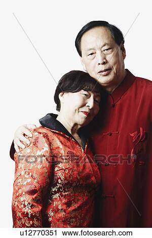 Stock Image - Portrait of a mature man embracing a mature woman. Fotosearch