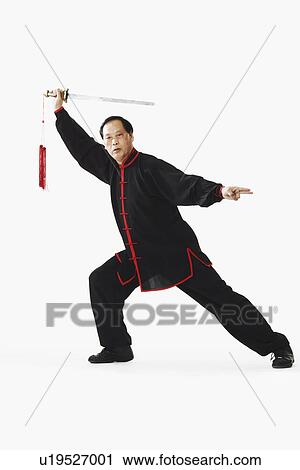 Portrait of a mature man holding a sword View Large Photo Image Stock Image - Portrait of a mature man holding a sword. Fotosearch