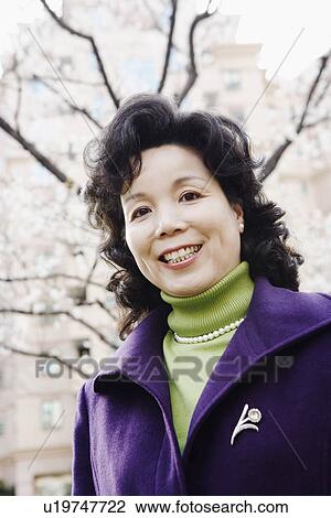 Stock Image - Portrait of a mature woman smiling. Fotosearch