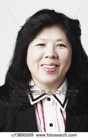 Stock Photo - Portrait of a mature woman smiling. Fotosearch