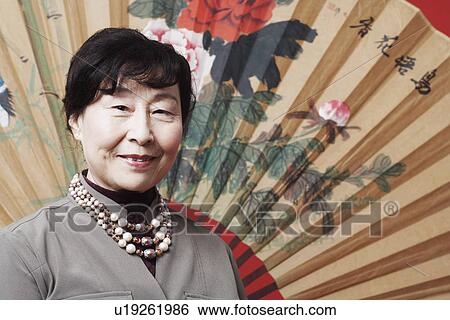 Stock Photograph - Portrait of a mature woman smiling. Fotosearch