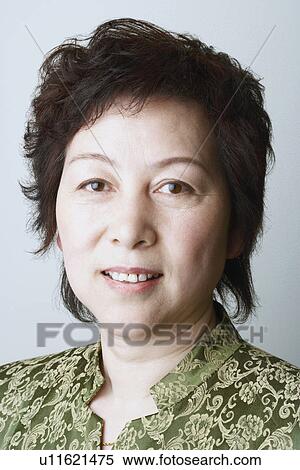 Stock Photography - Portrait of a mature woman smiling. Fotosearch