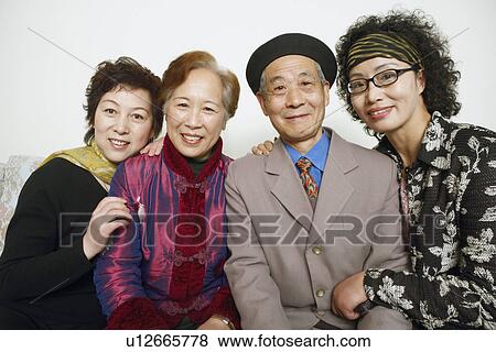 Portrait of a senior man sitting with three mature women View Large Photo Image Stock Photo - Portrait of a senior man sitting with three mature women. Fotosearch