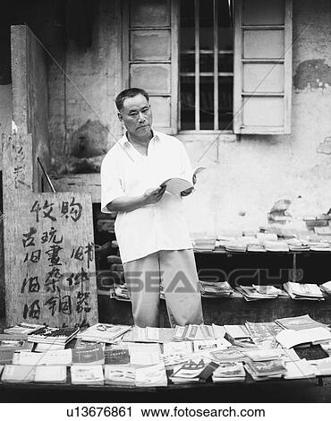 Stock Image - Mature man reading a book. Fotosearch